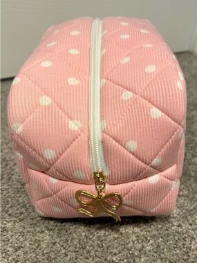 Krista Horton Staykation pink polka dot cosmetic bag with bow zipper pull
